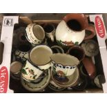 A box of assorted Torquay ware pottery items to include: jugs, egg cups, plates and bowls.