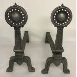 A pair of aluminium, Arts and Crafts style fire dogs.