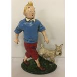 A painted cast iron doorstop of Tin Tin with Snowy.