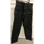 A pair of "Lewis Leathers" black leather motorcycle trousers with popper and zip fastening.