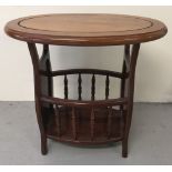 A modern oval topped side table with built in magazine rack/ galleried undershelf.