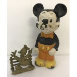 A vintage cast iron Mickey Mouse doorstop, with pie eyes and orange trousers.