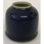 A small Chinese brush wash pot with deep blue glaze and ring mark to underside.