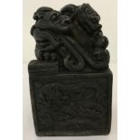 A large hollow bronze cube shaped seal with dragon design to panelled sides.