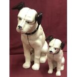 2 cast iron money banks in the shape of the HMV dog.