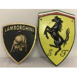 2 painted cast iron, wall hanging, shield shaped plaques; Lamborghini and Ferrari.