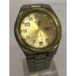 A men's Seiko 5, automatic, water resistant watch in working order.