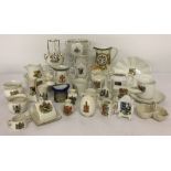 A box of assorted crested ware ceramics to include novelty miniature ornaments, jugs and vases.