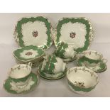 A vintage Fenton bone china part tea set with green and gilt detail.