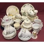 A quantity of tea ware in a variety of patterns.