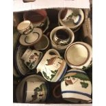 A box of assorted Torquay ware pottery items to include: plates, egg cups, jugs and dishes.