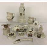 A collection of novelty shaped crested ware china ornaments.