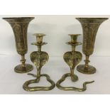 A pair of brass snake candle holders.