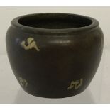 A small Chinese bronze pot with gold splash detail.