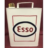 A rectangular shaped Esso fuel can in white with bras brass top lid and red & blue painted detail.
