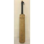 A vintage signed long handle Slazenger cricket bat. Autographed by players from the 1960's & 70's.