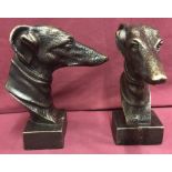2 cast metal greyhound heads with gold tone colouration.