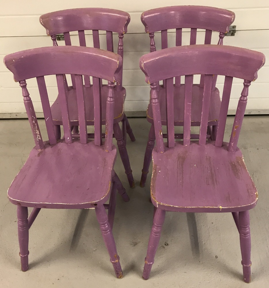 A set of 4 vintage pine slat back kitchen chairs, painted purple.
