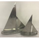 A pair of aluminium ornamental yachts, by Nauticalia, London.