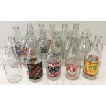 A box of 24 vintage advertising milk bottles.