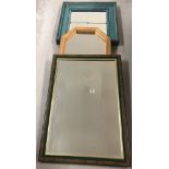 A collection of 3 modern framed mirrors.