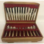 A vintage 40-piece canteen of cutlery in "Sanenwood" pattern, with wooden handles.