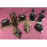 A collection of carved wooden elephant items.