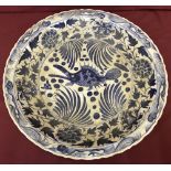 A very large, hand painted, Chinese blue and white charger.