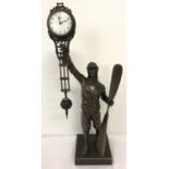 A bronze based figural, swinging pendulum mystery clock.