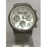 A ladies MK-5020 Michael Kors chronograph watch with mother of pearl face and stainless steel strap.