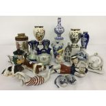 A collection of small ceramic ornaments to include Delft, Masons and Colibri table lighter.