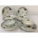 2 ceramic tea bowls and saucers in floral designs.