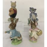 4 small ceramic collectable figurines.