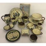 A collection of 15 vintage Torquay pottery items and a book.