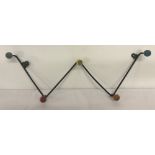 A c.1960s Sputnik metal coat rack for wall mounting.