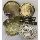 A collection of brass and silver plated items.