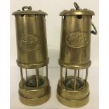 2 vintage brass Welsh miners lamps with "Cymru" plaques to front.