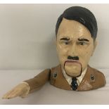 A painted cast iron Adolf Hitler nut cracker with moving arm action,