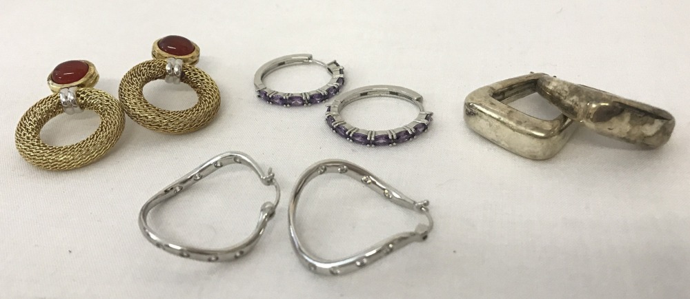 4 pairs of modern design ladies earrings.