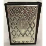 A large wood and leather matchbox holder, for Shabbat, with silver decorative plate to front.