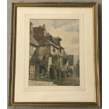 A framed and glazed watercolour depicting a Tudor style street scene signed Celia Lewis.
