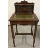 A Victorian inlaid ladies writing desk with leather insert to lift up lid.