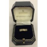 A tri colour 9ct gold diamond set eternity ring.