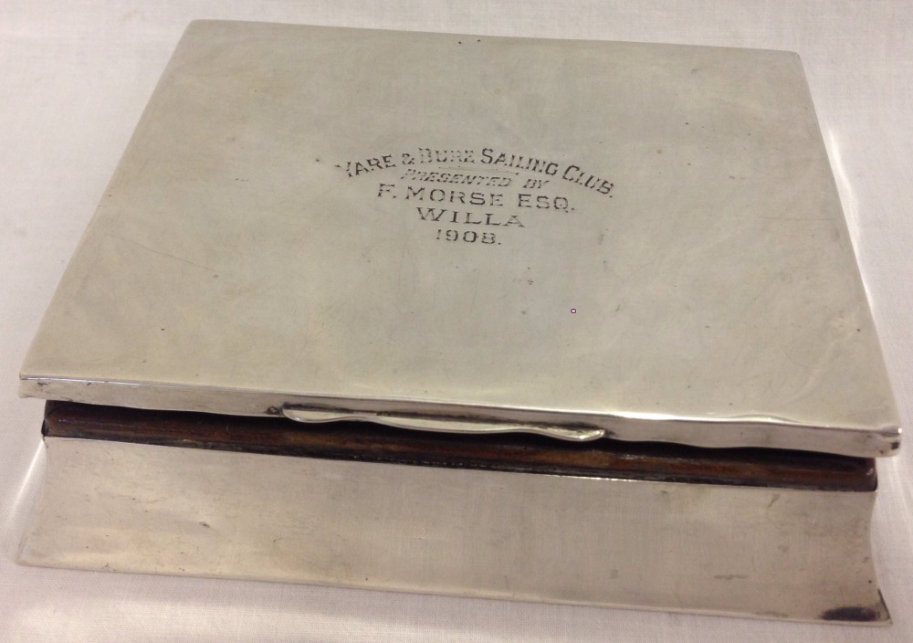 An Edwardian silver cigarette/cigar box with inscription to top.