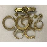 A small quantity of 9ct scrap gold. To include earrings, broken chains and a brooch.