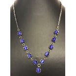 A silver and blue agate stone set necklace.