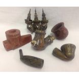 A collection of antique smoking pipe bowls.