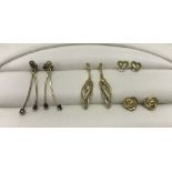 4 pairs of 9ct gold earrings. Hallmarked or test as 9ct. Some earrings without backs.