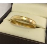 A 14ct gold wedding band. Size U. Total weight approx. 3.8g.