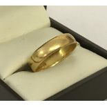 A 22ct gold wedding band. Size Q½.
